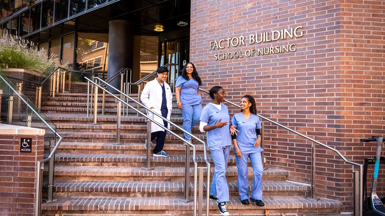 Nursing students walking out of the factor building