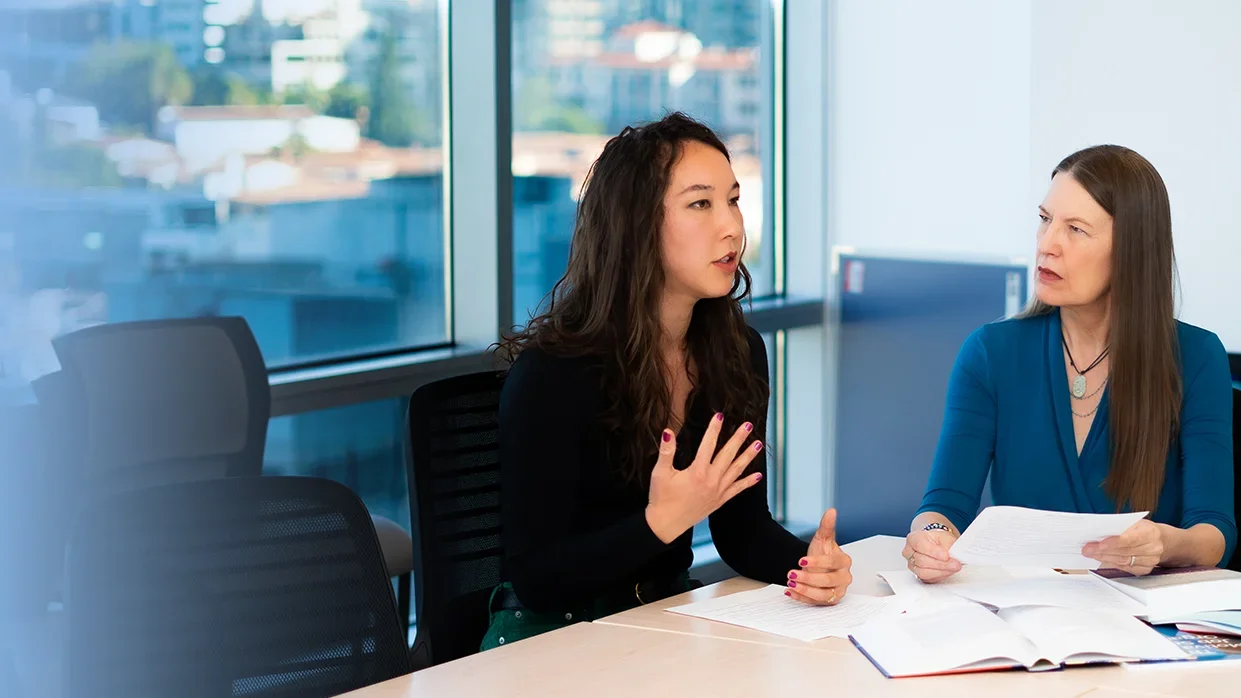 Kristen Choi and MarySue Heilemann discussing NCSP projects