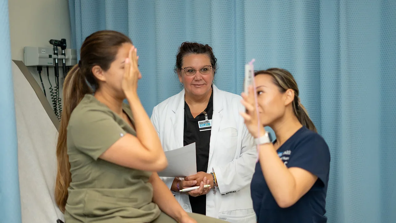 A stock image of a PhD student working with others