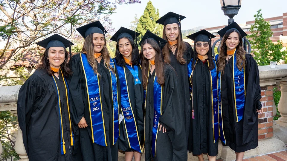 Students posing for aphoto at commencement