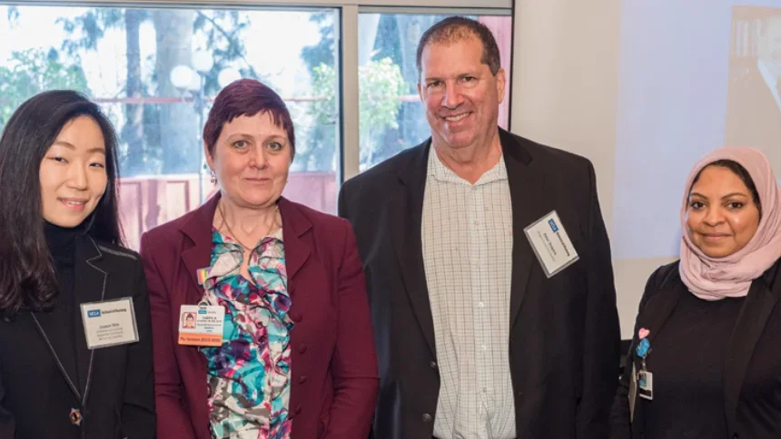 Four people wearing name tags at a SON donor event