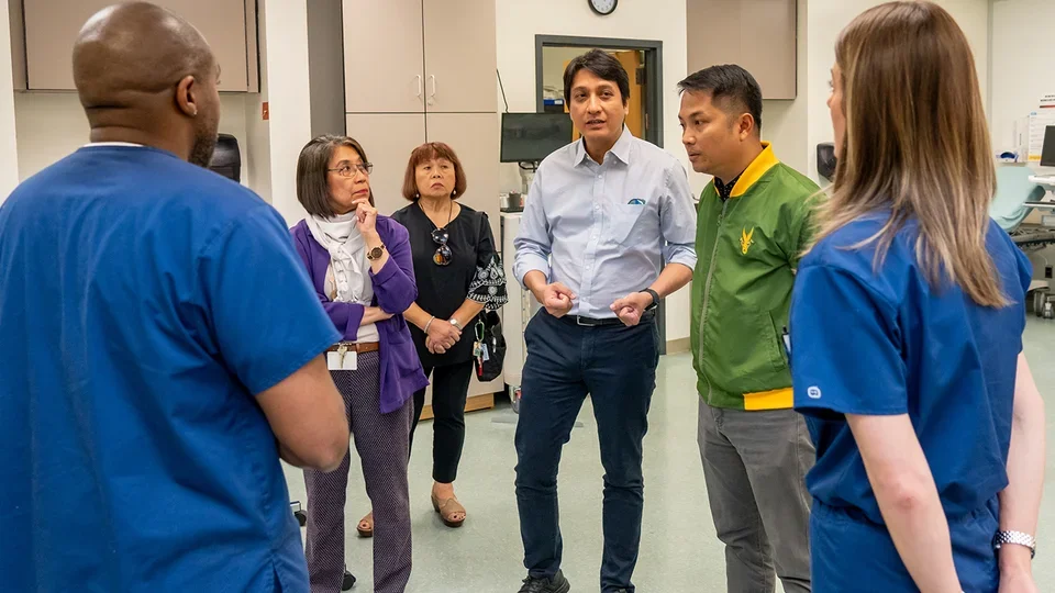 Far Eastern University officials touring the UCLA Simulation Lab