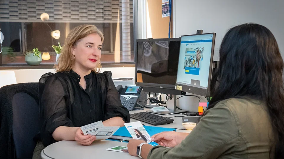 Director of Financial Aid Leonie Thomas speaking with a student