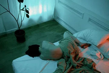 A person lying in bed