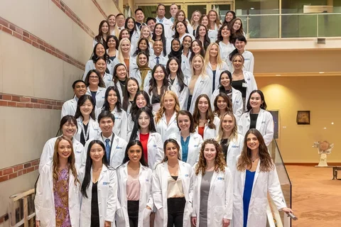 APRN students with their white coats