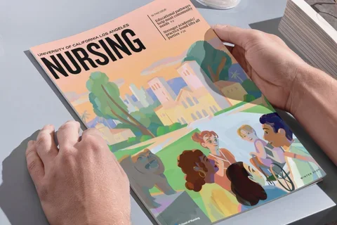 A person looking at the 2025 UCLA Nursing Magazine