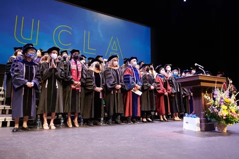 Faculty members on stage during commencement