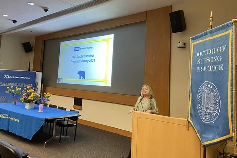 Dr. Nancy Jo Bush speaking at the DNP Scholarly Projects event