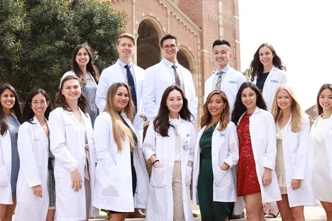 APRN students with their white coats