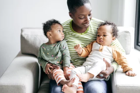 A mother with her 2 young children