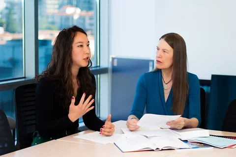 Kristen Choi and MarySue Heilemann discussing NCSP projects