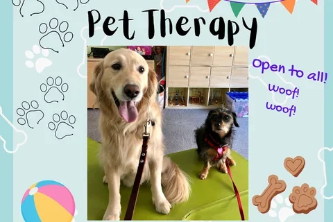 A graphic with the text Pet Therapy and a photo of 2 dogs
