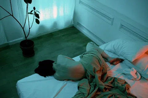 A person lying in bed