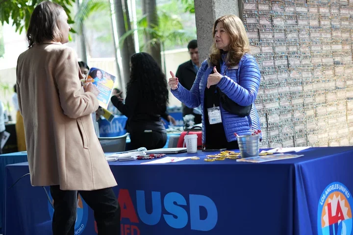 LAUSD rep speaking with students at the Career Fair