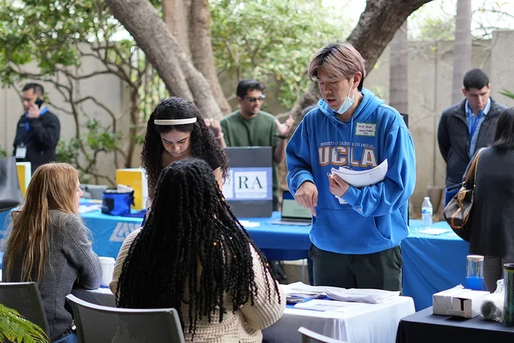 Student speaking with health care reps at the Career Fair