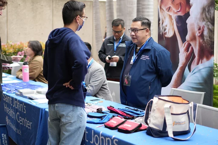 Students speaking with recruiters at the nursing career fair