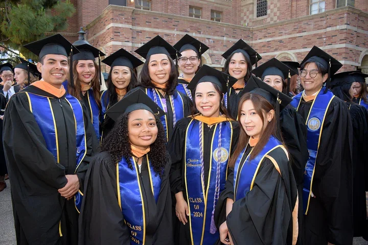 Students posing for a photo at commencement