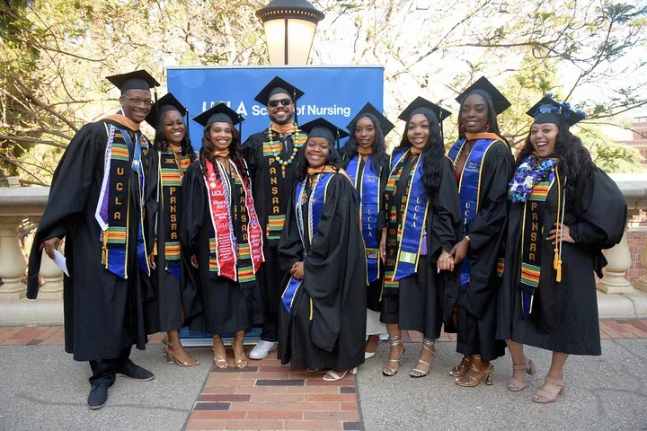 Students posing for a photo at commencement