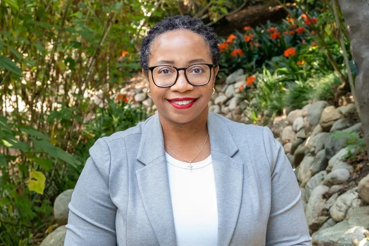 Kamala Gipson-McElroy standing in the UCLA Botanical Garden