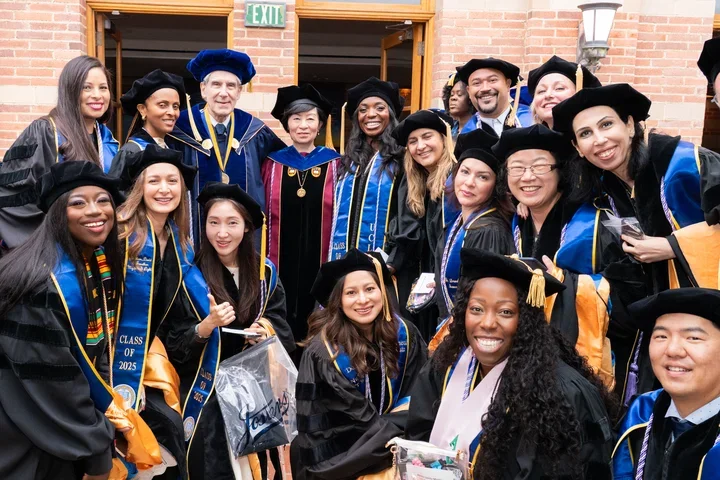 Doctoral students gathered with Chancellor Julio Frenk and Dean Lin Zhan