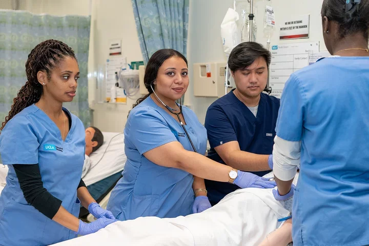 A photo fo students working in the Simulation Lab