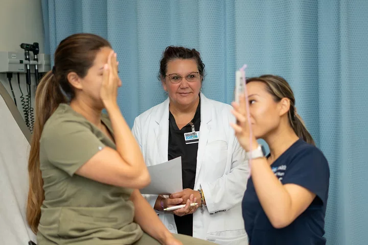 A stock image of a PhD student working with others