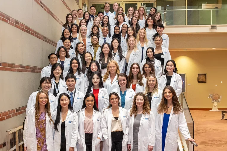 APRN students with their white coats