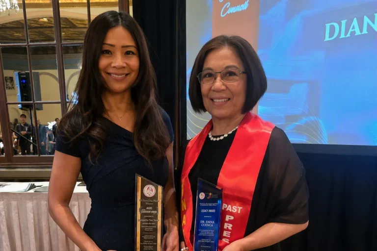 Carol Cunningham and Emma Cuenca holding their awards at the PNASC Award Ceremony. 