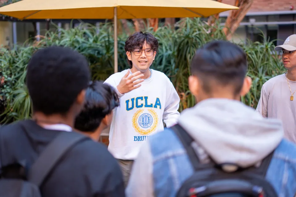 A student presenting at the student org fair