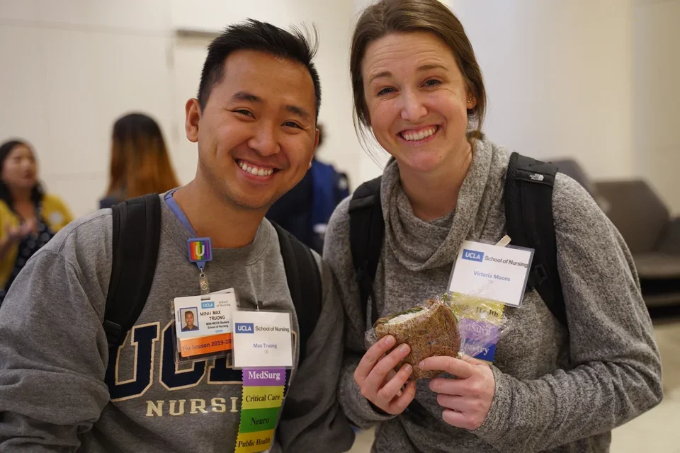 Two students wearing SON name tags