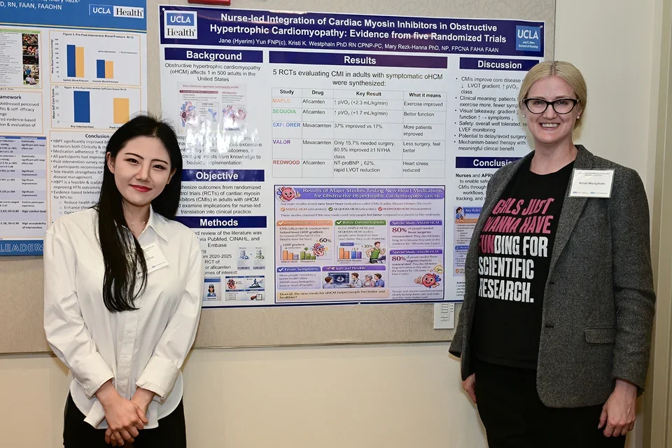 Nusing student Jane Yun and assistant professor Kristi Westphaln with their poster presentation.