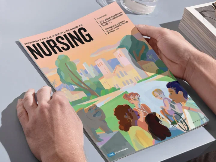 A person looking at the 2025 UCLA Nursing Magazine