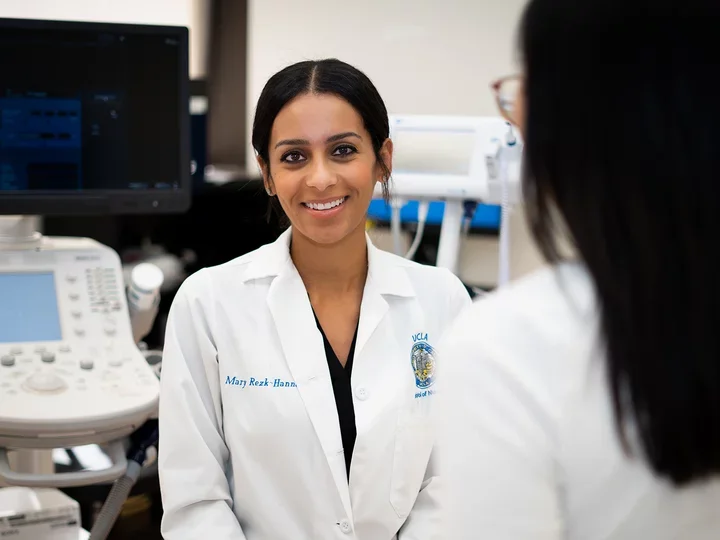 UCLA Nursing faculty member with a patient