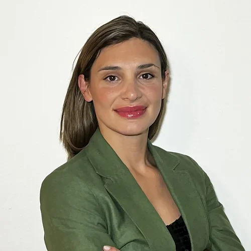 Dubravka Labovic wearing a green jacket and black shirt. 