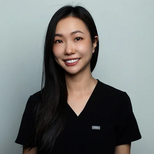 Lillian Wong wearing black scrubs