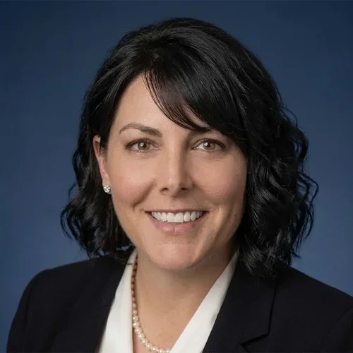 Stacey Green wearing a white shirt and black jacket.