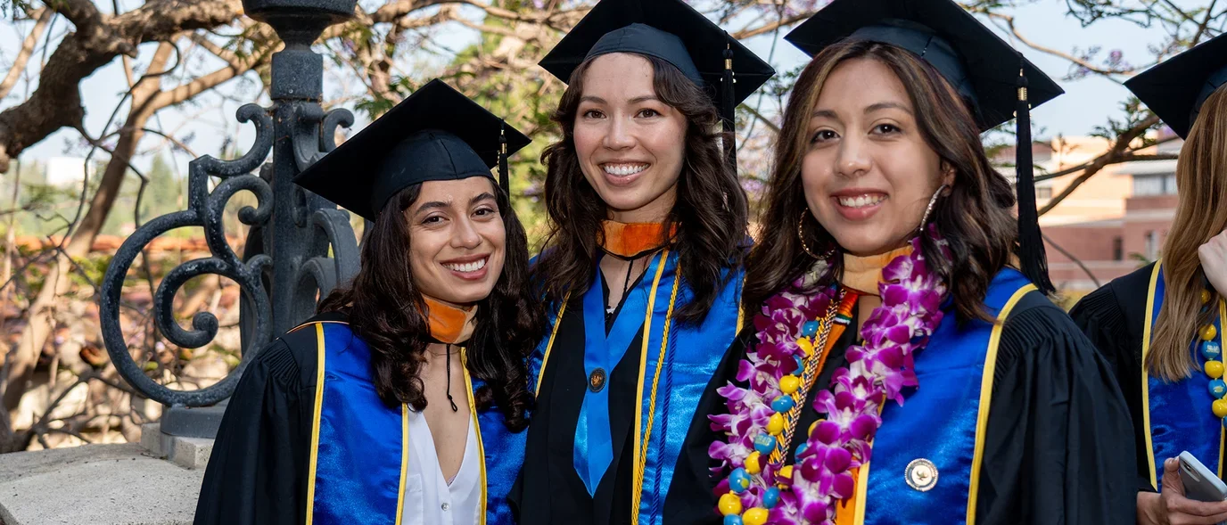 Students posing for aphoto at commencement