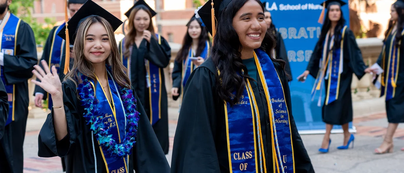 Students posing for aphoto at commencement