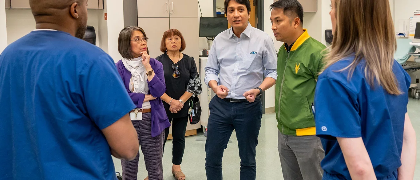 Far Eastern University officials touring the UCLA Simulation Lab