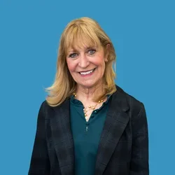 Barbara Bates-Jensen in dark grey jacket and green shirt. 