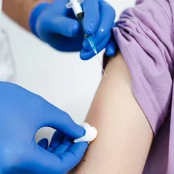 A stock image of someone about to get a vaccination shot