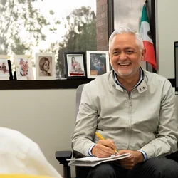 Robert Lucero sitting with a colleague at UCLA Nursing