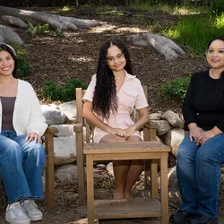 Nursing students Julie Bernardo, Vanessa Martinez, and Danielle Paisley sitting in the UCLA Botanical Garden.