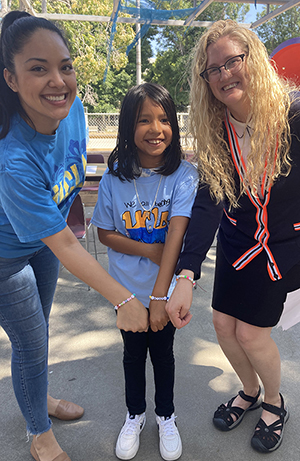 UCLA faculty members with a child in the healthy communities program