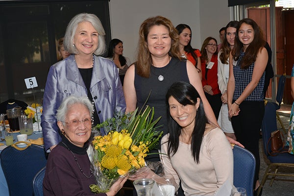 Helen Shishino (seated) with Dean Linda Sarna and daughters Laurie Shishino (seated right) and Linda Shishino-Cruz