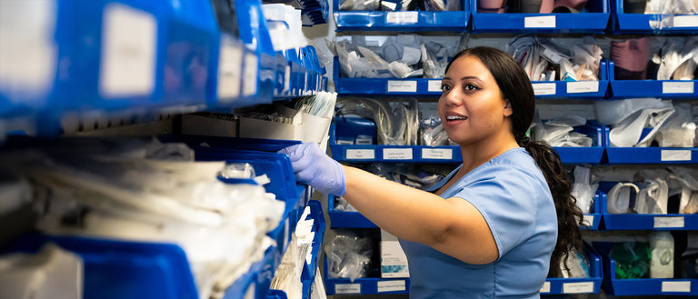 A student getting supplies from the Nursing Simulation Lab supply room