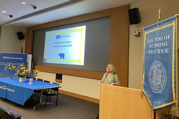 Dr. Nancy Jo Bush speaking at the DNP Scholarly Projects event
