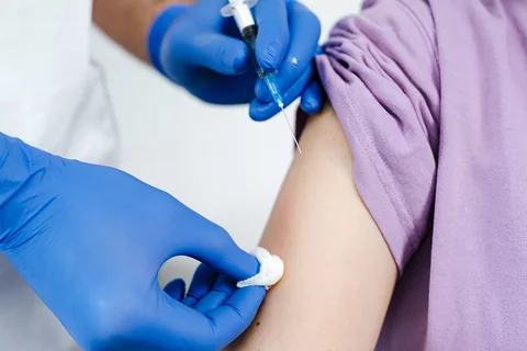 A stock image of someone about to get a vaccination shot