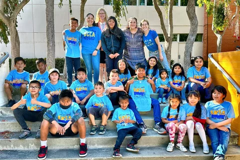 Children gathered with UCLA faculty members leading the Healthy Communities program