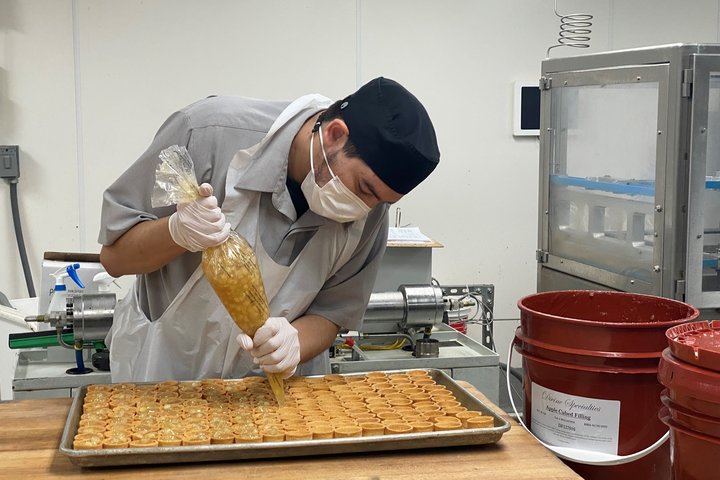 Steven Asadilla working in the bakery